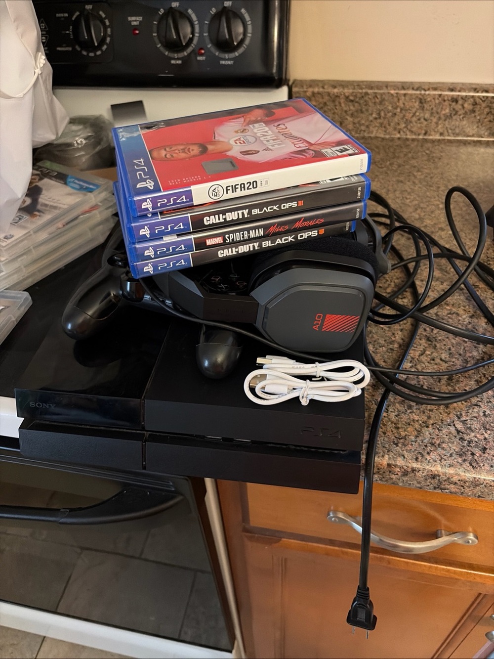 Sony PS4 500 GB (FAT) Bundle in Black W/Astro A10 Headset, Controllers & Games